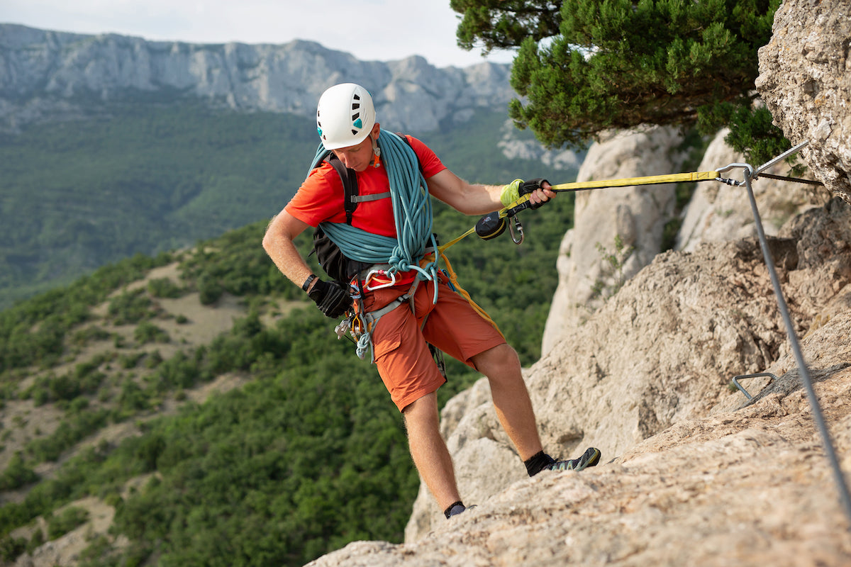 athletically-built-man-climbs-a-rock-using-a-rope-2022-09-08-19-06-03-utc.jpg